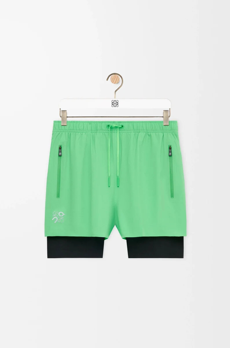 performance shorts in technical shell green
