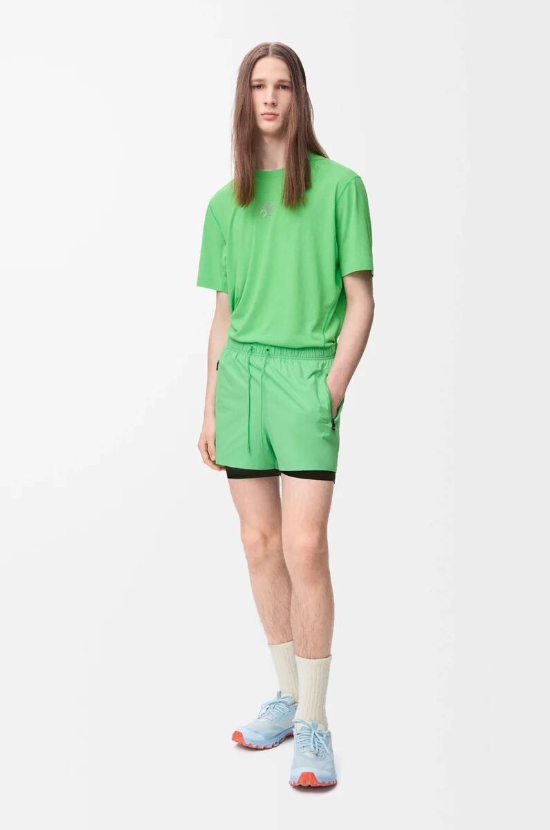 performance shorts in technical shell green
