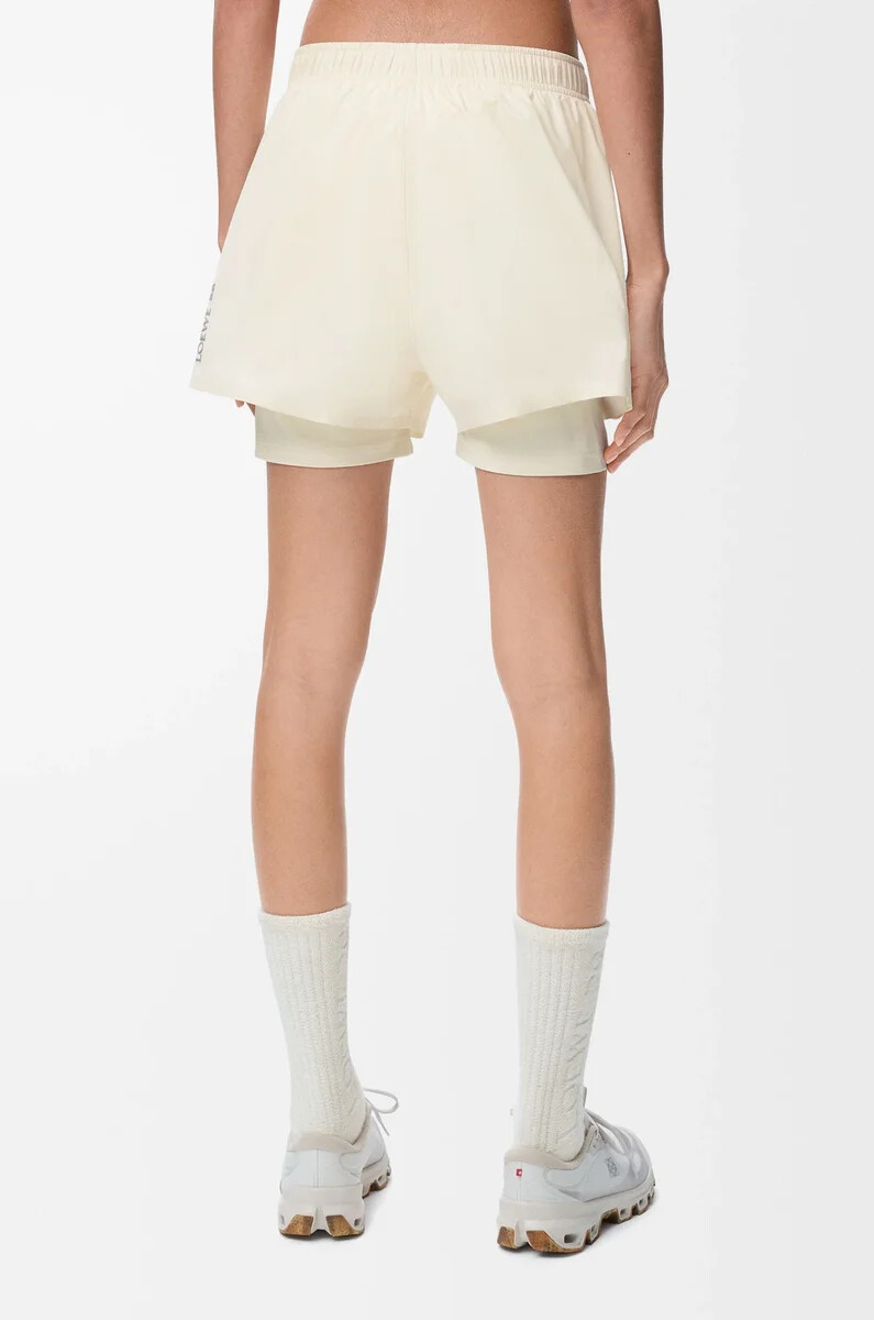 performance shorts in technical shell ivory